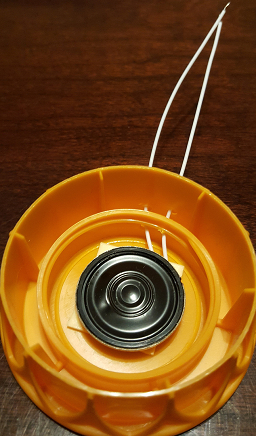 A cheap speaker in a plastic housing